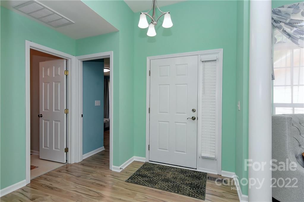 1421 Autumn Ridge Lane Fort Mill, SC 29708 - Photo 4 of 48 a view of an empty room with window and wooden floor