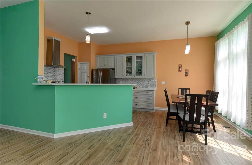 1421 Autumn Ridge Lane Fort Mill, SC 29708 - Photo 10 of 48 a view of a dining room with furniture and wooden floor