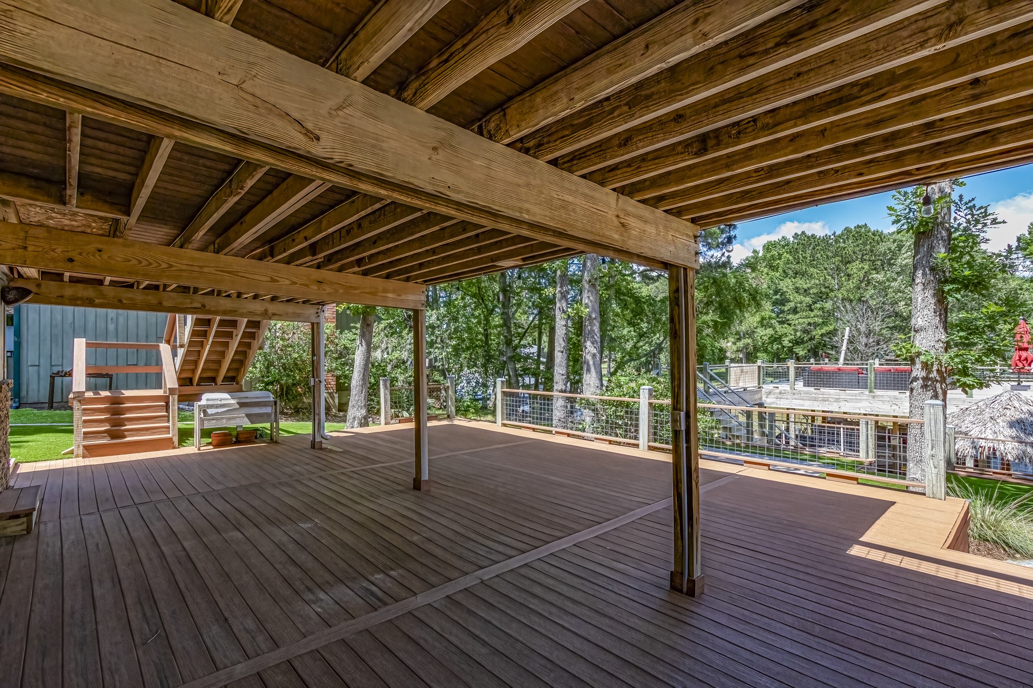 470 South Lakeview Drive Point Blank, TX 77364 - Photo 23 of 33 Large deck on bottom of house.