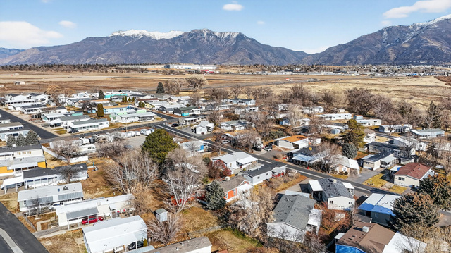 269 Mindella Way, Unit A Layton, UT 84041 - Photo 29 of 37 Aerial view of residential area with a mountain backdrop