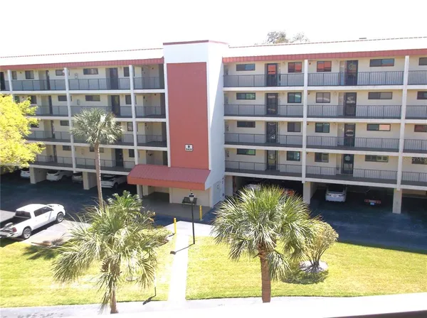 a view of a swimming pool with a lounge chairs