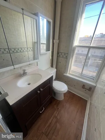 a view of a backyard and a street