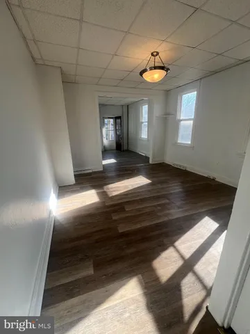a view of a livingroom with furniture and staircase