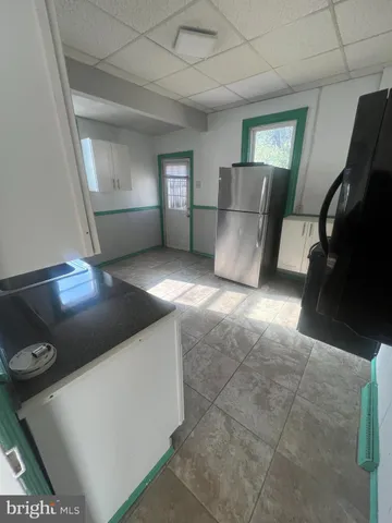 a living room with a couch and a stove top oven