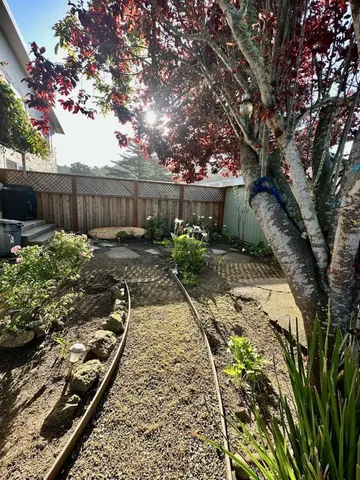 a backyard of a house with lots of green space