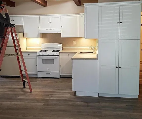 a view of a kitchen with a sink