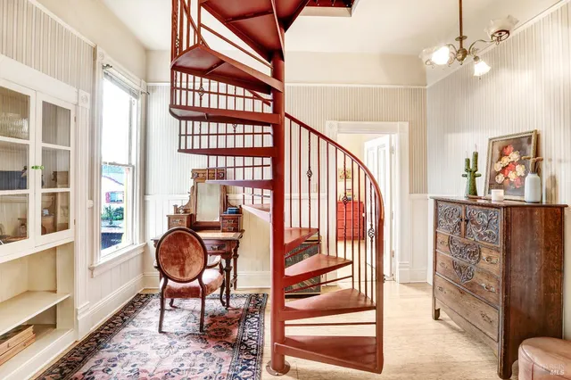 a view of a livingroom with furniture and a window
