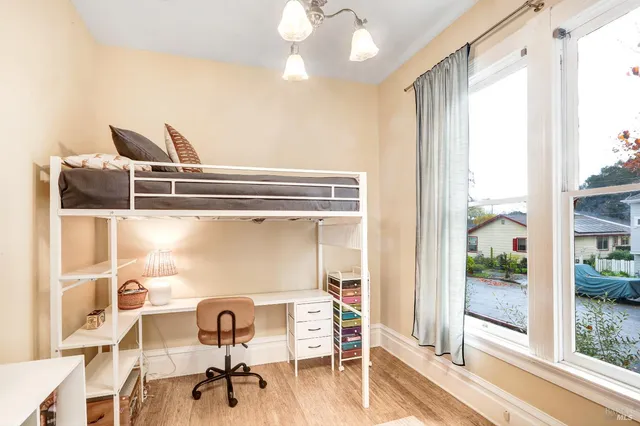 a water heater sitting in a bedroom next to a window