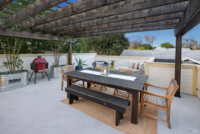 a outdoor dining space with furniture