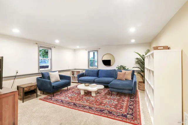 a living room with furniture and a couch