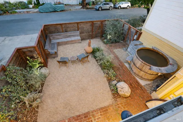 a backyard of a house with outdoor seating