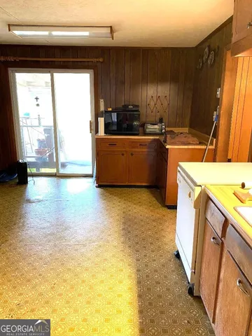 a kitchen with sink cabinets and window