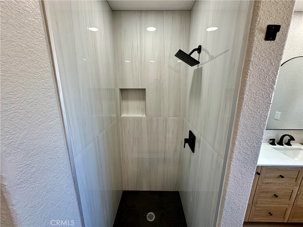 625 Tamarack Road Pinon Hills, CA 92372 - Photo 17 of 27 a bathroom with a sink and shower