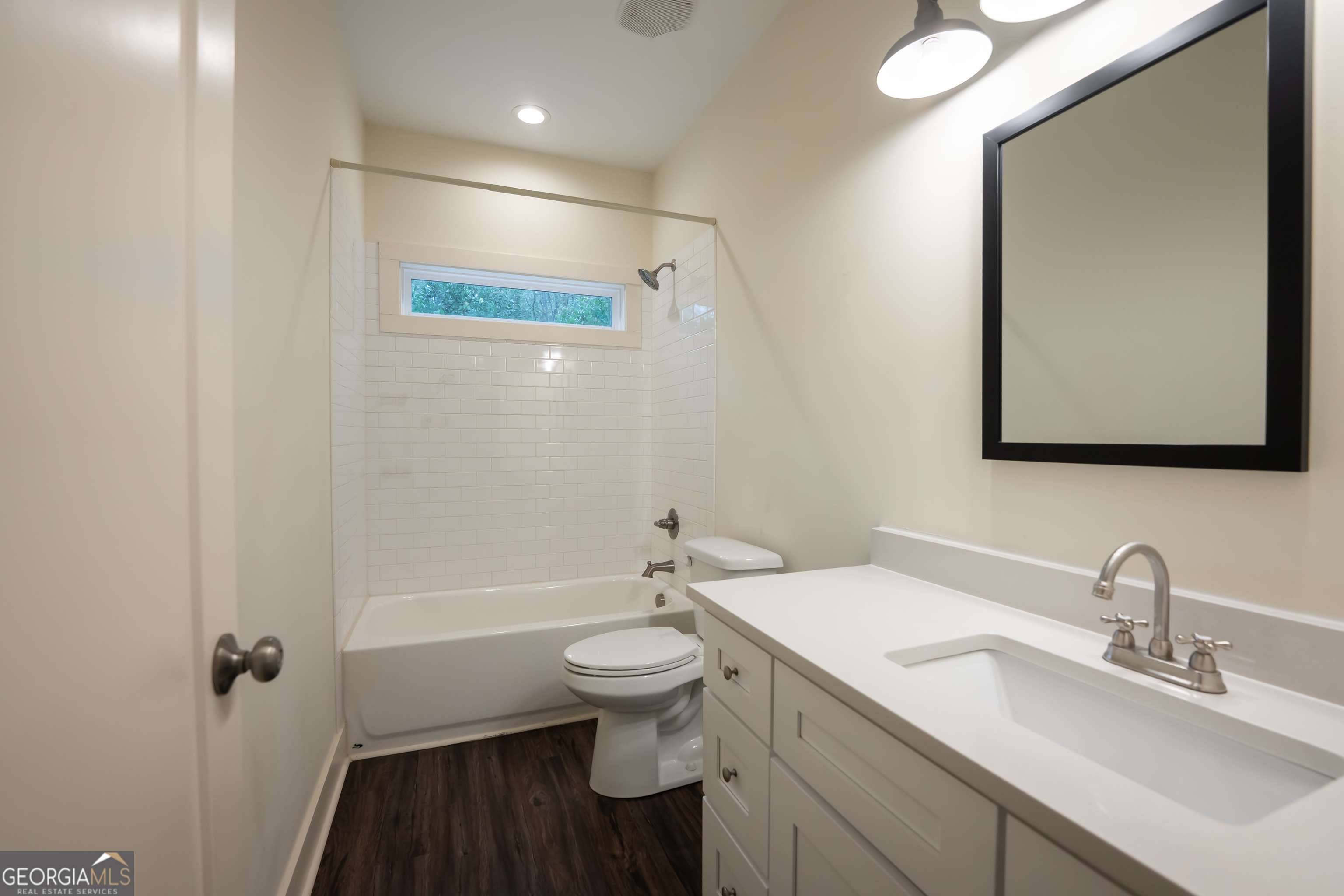 1020 Bell Circle Madison, GA 30650 - Photo 12 of 17 a bathroom with a sink a toilet and shower