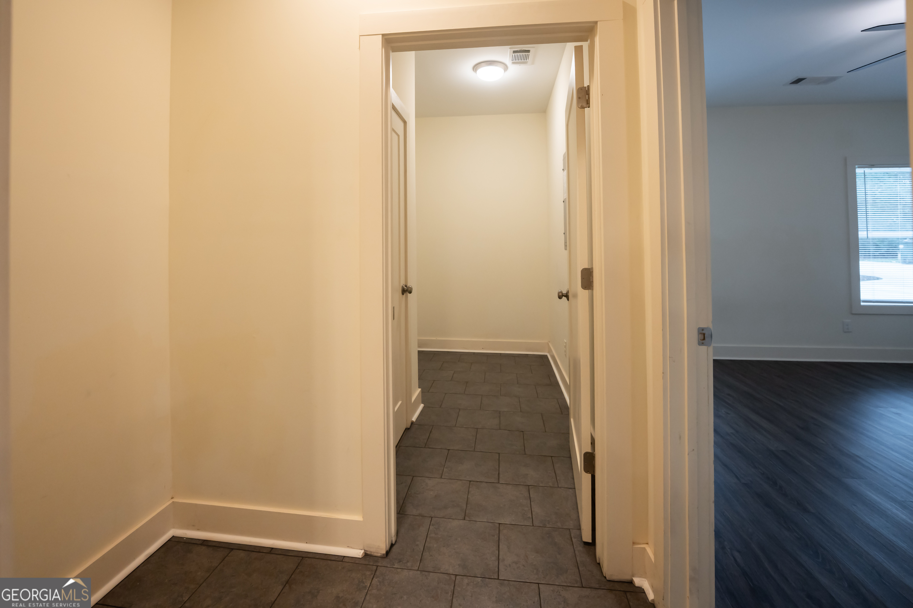 1020 Bell Circle Madison, GA 30650 - Photo 14 of 17 a view of a hallway with wooden floor