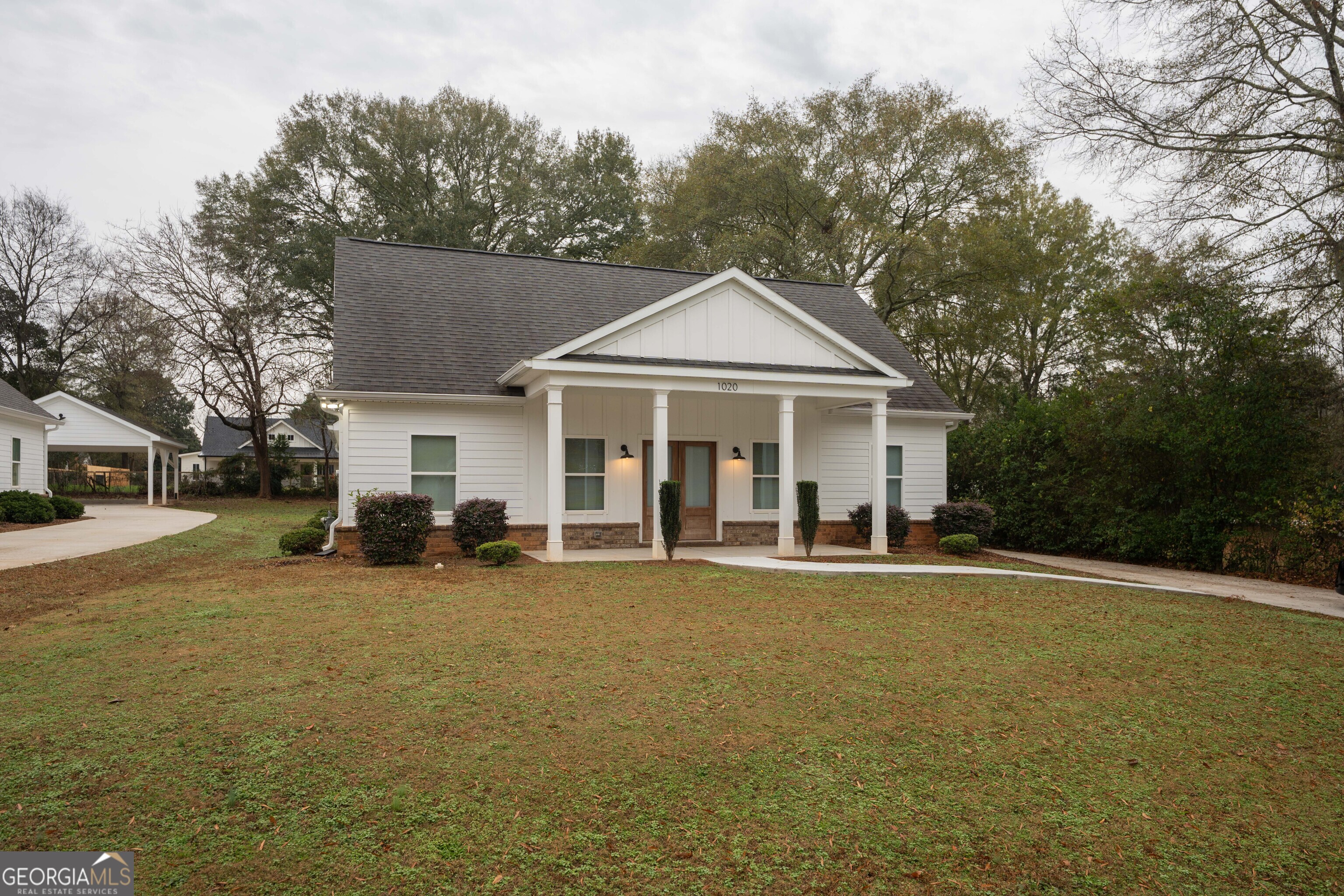 1020 Bell Circle Madison, GA 30650 - Photo 15 of 17 a view of a house with a yard and large tree