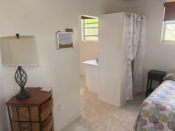 a view of a hallway with entryway door