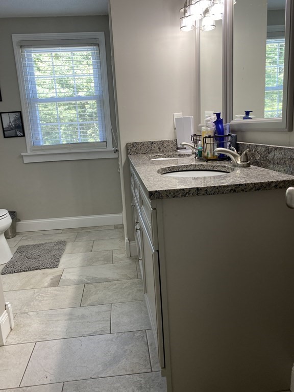 88 Fair Oak Road Springfield, MA 01128 - Photo 23 of 34 a bathroom with a sink and a mirror