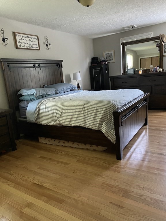 88 Fair Oak Road Springfield, MA 01128 - Photo 26 of 34 a bed sitting in a bedroom next to a window with tv