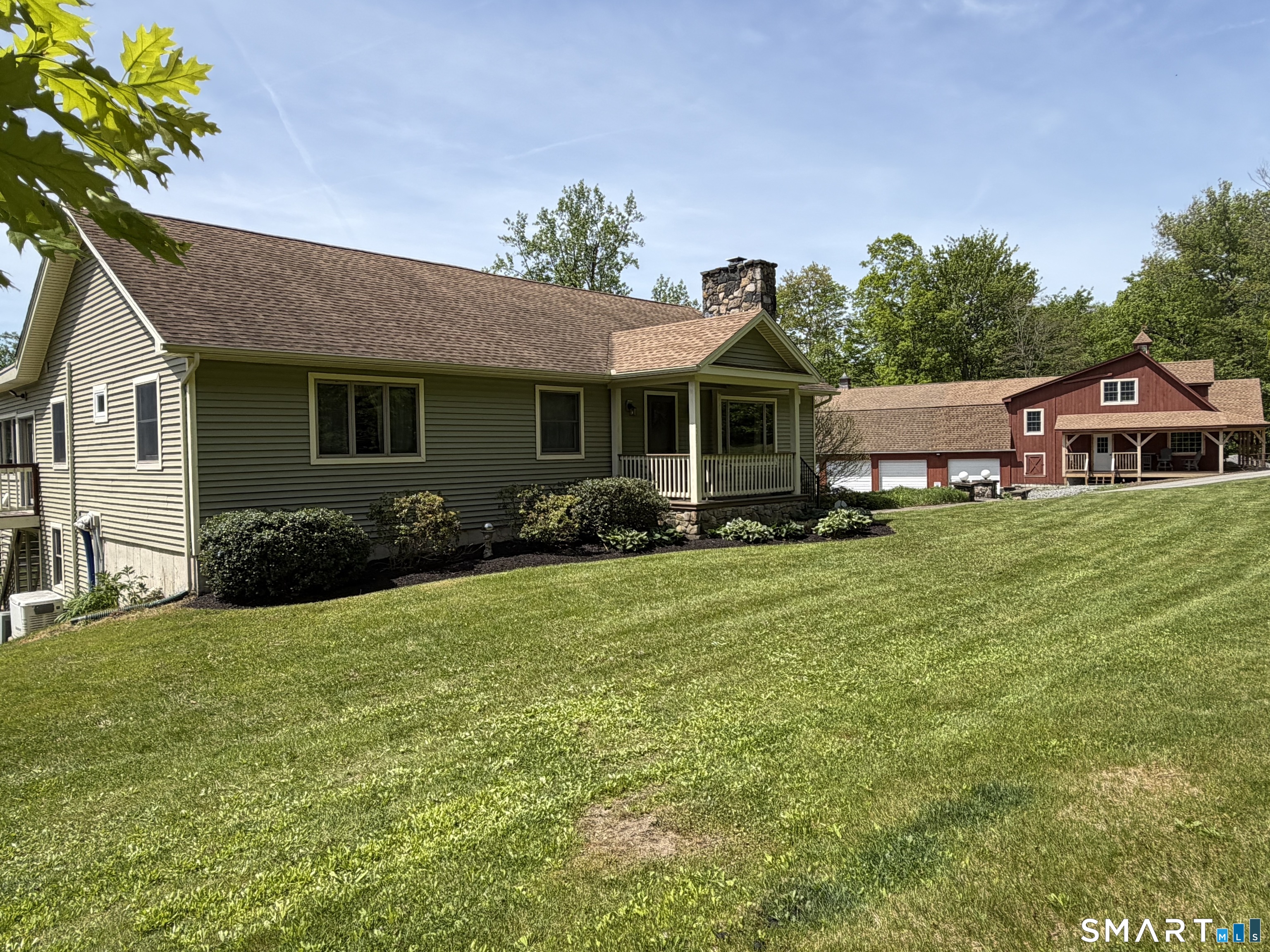 80 Holmes Road Goshen, CT 06756 - Photo 2 of 40 a front view of house with yard and green space