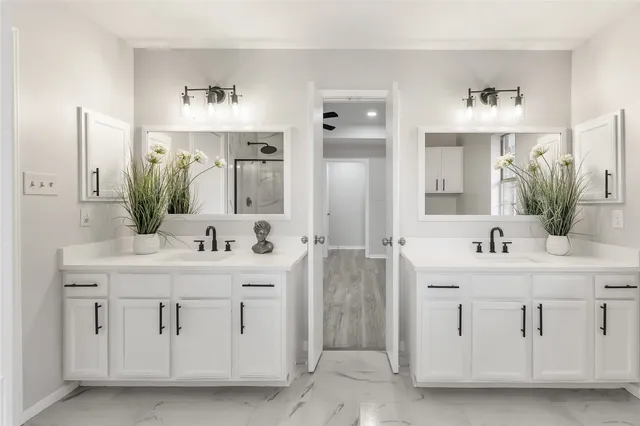 a bathroom with a bathtub toilet and shower