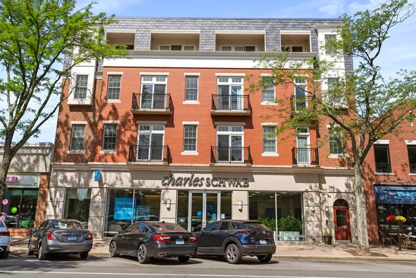 a view of a car parked in front of a building
