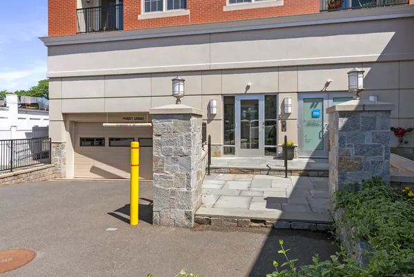 a view of building with glass door