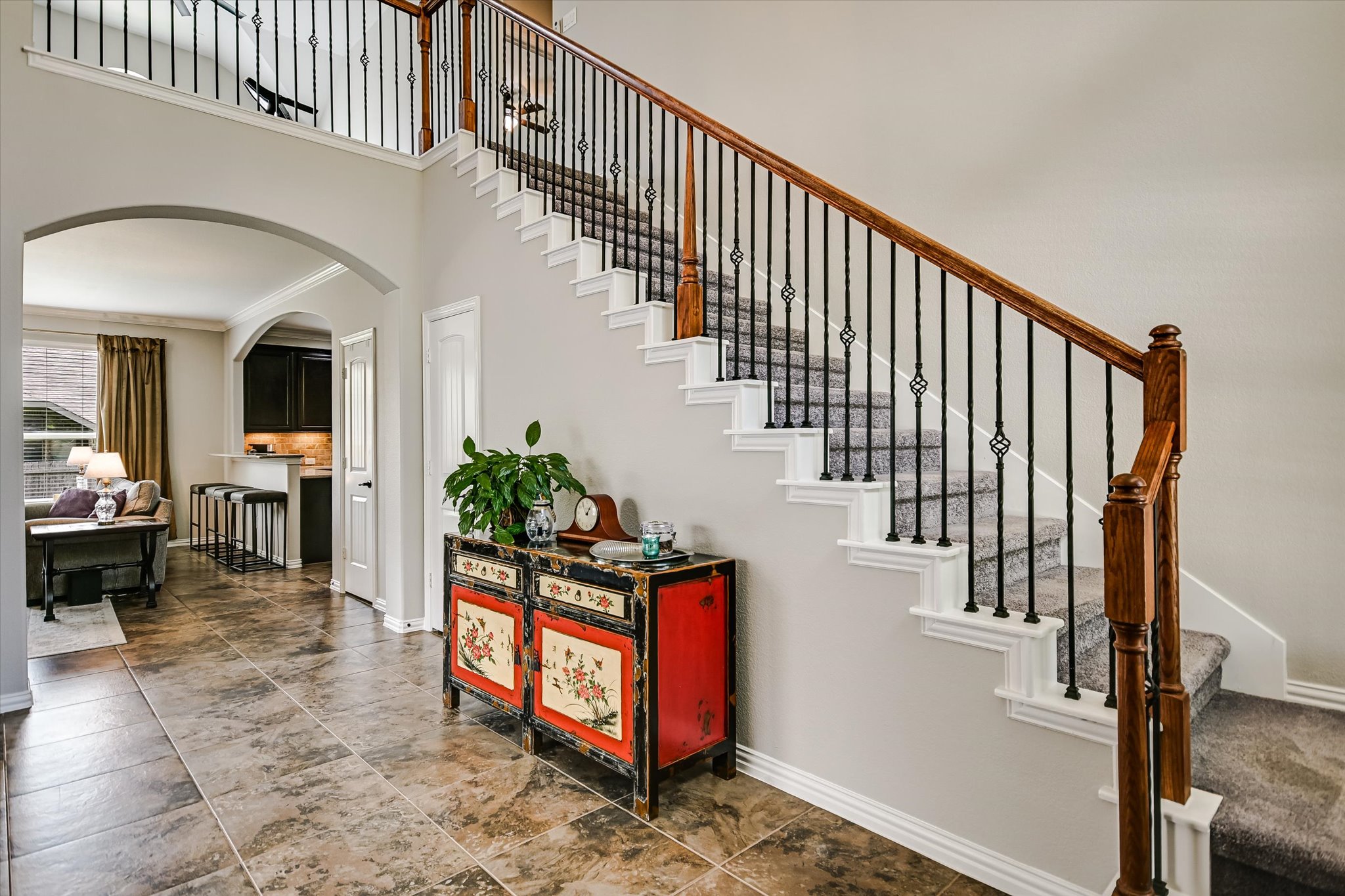 4623 Chestnut Meadows Bend Georgetown, TX 78626 - Photo 5 of 30 a view of staircase with lots of frames on wall and a chandelier
