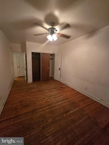 an empty room with a empty space and windows