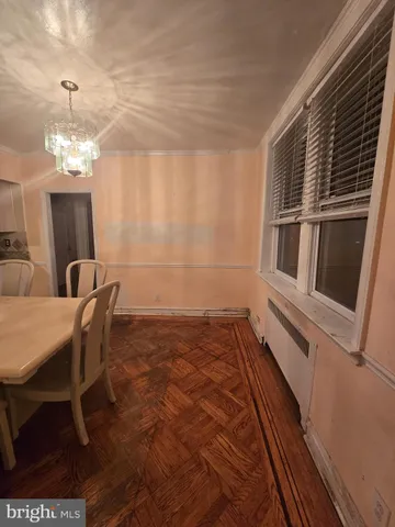 a kitchen with stainless steel appliances granite countertop a sink a stove and white cabinets