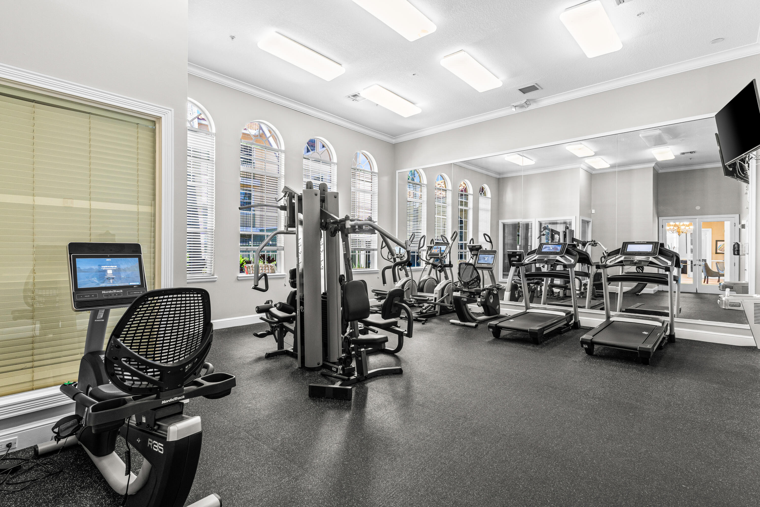 1951 Brandywine Road East, Unit 77105 West Palm Beach, FL 33409 - Photo 16 of 35 a view of a room with gym equipment