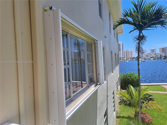 a view of a swimming pool with a yard