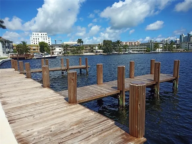 a terrace with wooden bench and potted plants