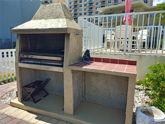 a front view of building with an outdoor seating