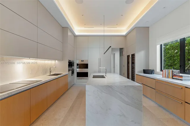 a bedroom with a large bed and a large window