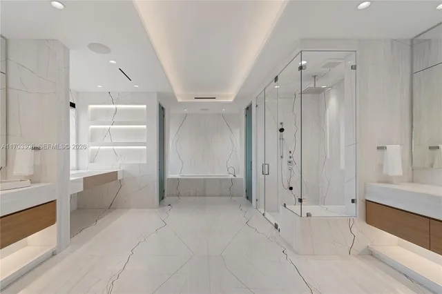 a bathroom with bathtub and a shower