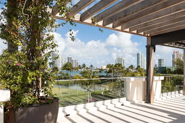 a view of a lake with a palm tree