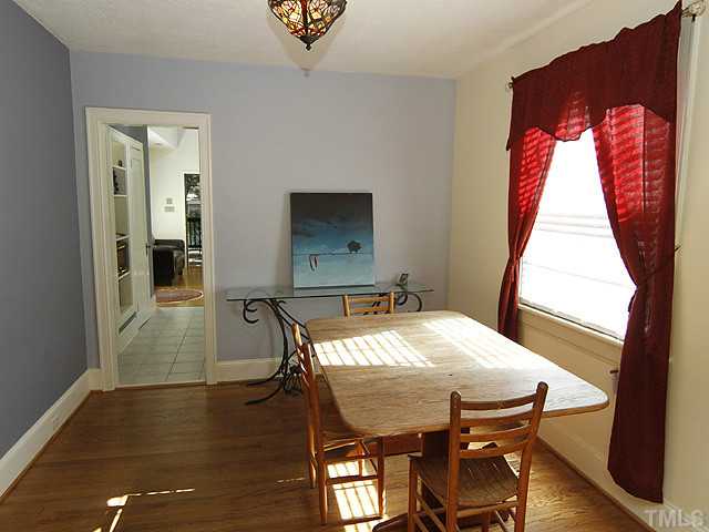 309 Cedar Street Raleigh, NC 27604 - Photo 6 of 25 a view of a dining room with furniture and wooden floor