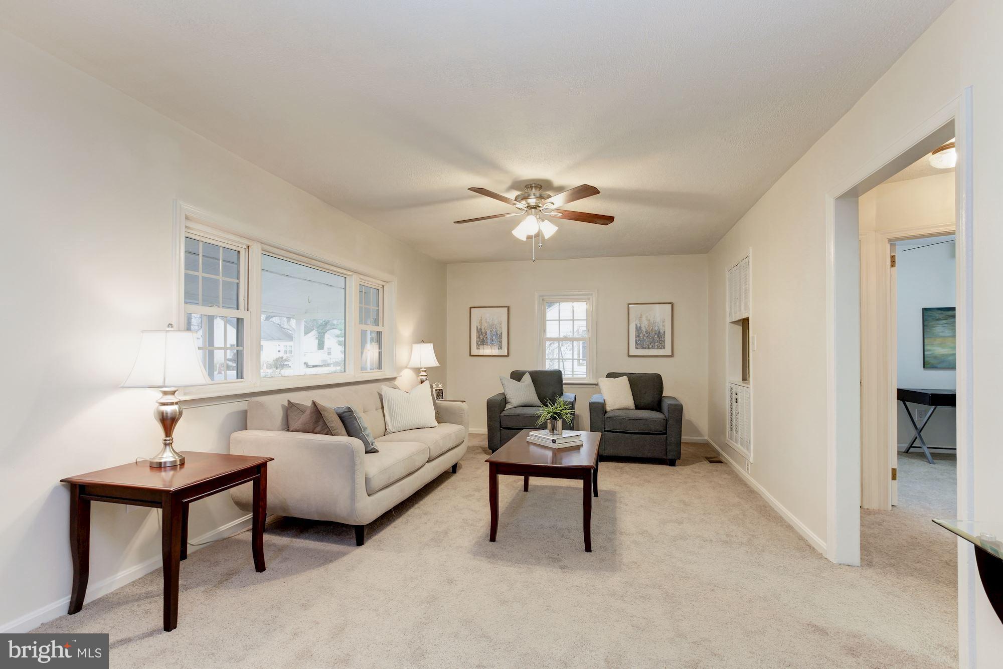 11704 Joseph Mill Road Silver Spring, MD 20906 - Photo 3 of 20 a living room with furniture and a table