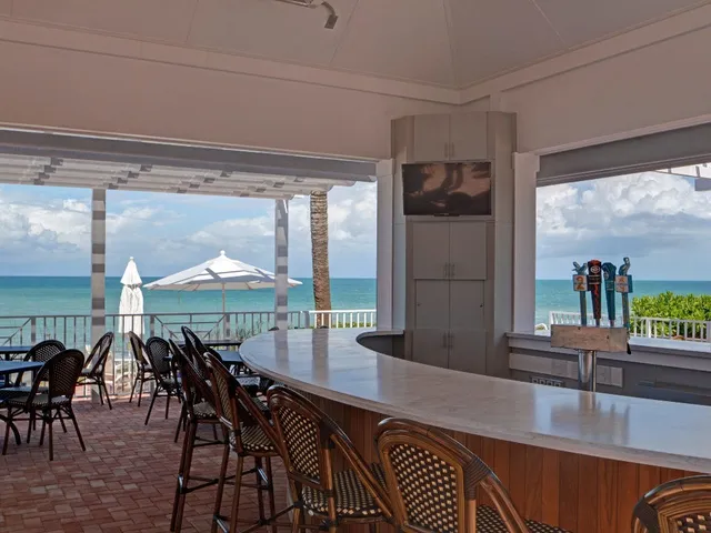 a dinning area with furniture and window