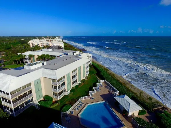 a view of a balcony with chairs