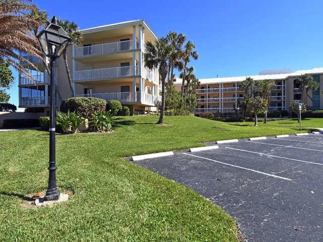 a kitchen with a refrigerator and cabinets