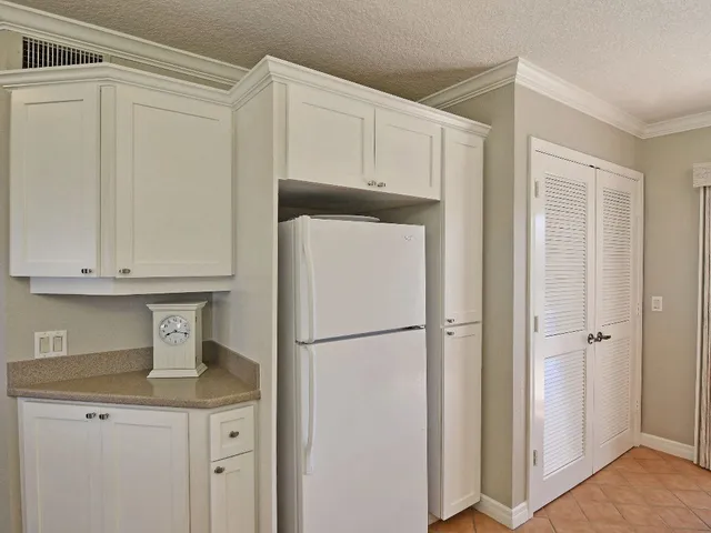 a view of a hallway with entryway wooden floor and front door