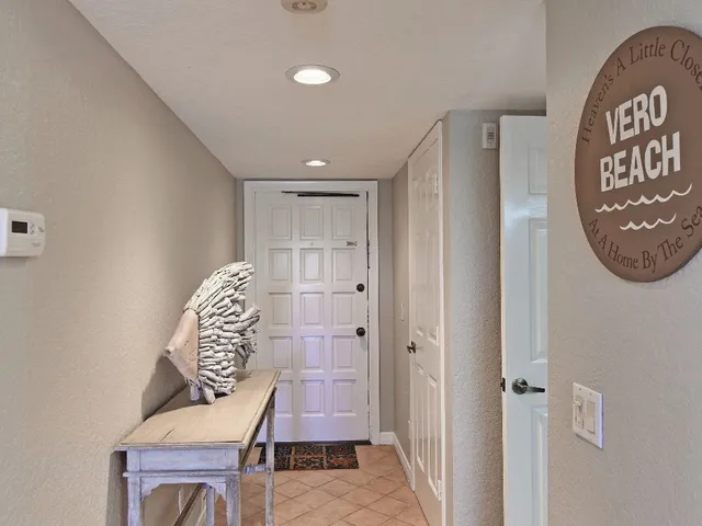 a living room with furniture ceiling fan and a rug