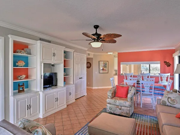 a living room with furniture and flat screen tv