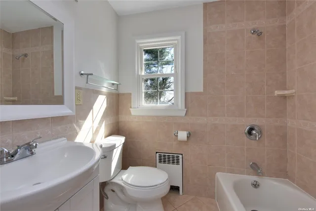 a bathroom with a sink a toilet and a bathtub