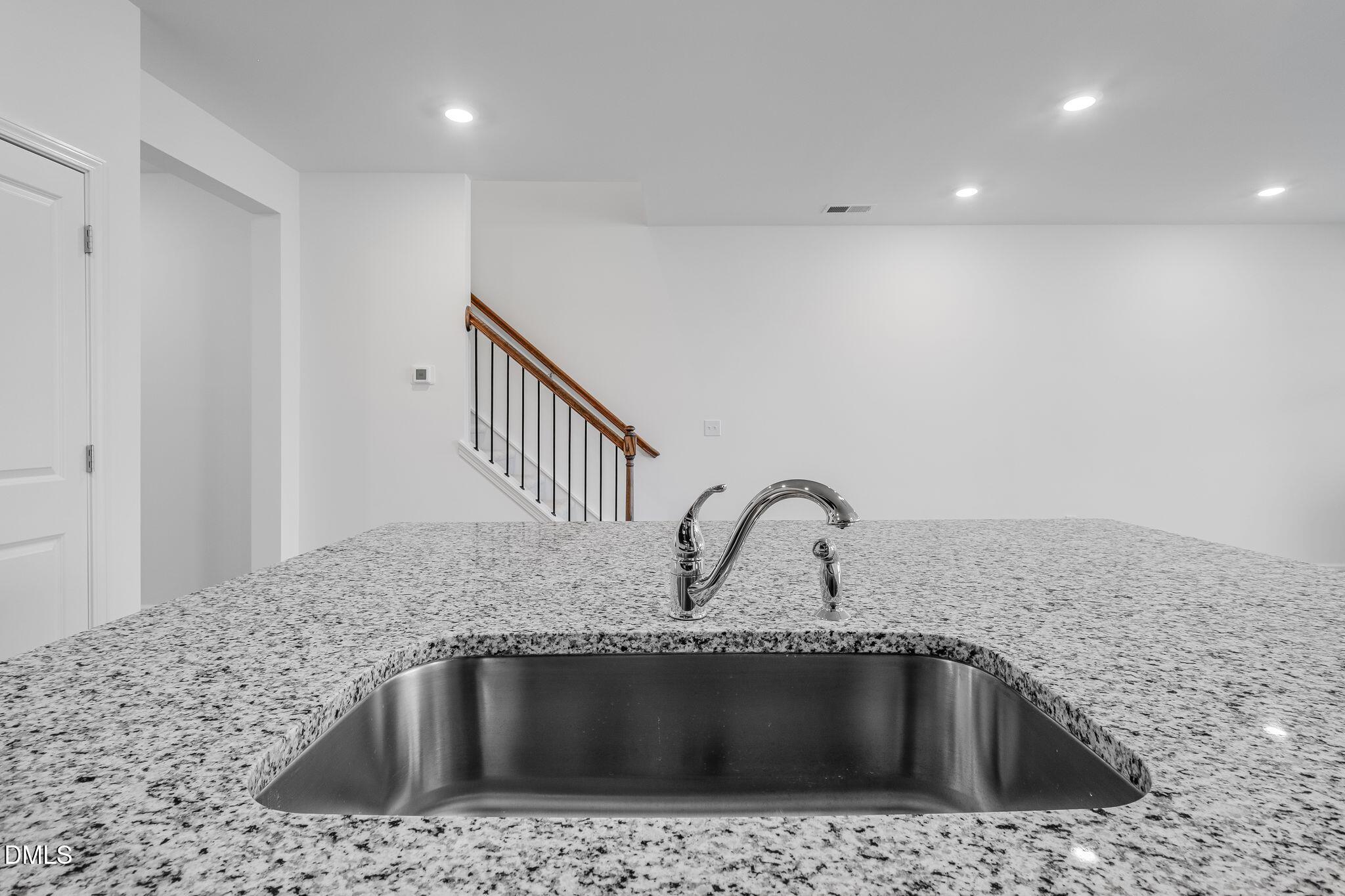 2939 Hickory Fld Drive Raleigh, NC 27616 - Photo 14 of 30 a kitchen with a sink a counter and stainless steel appliances