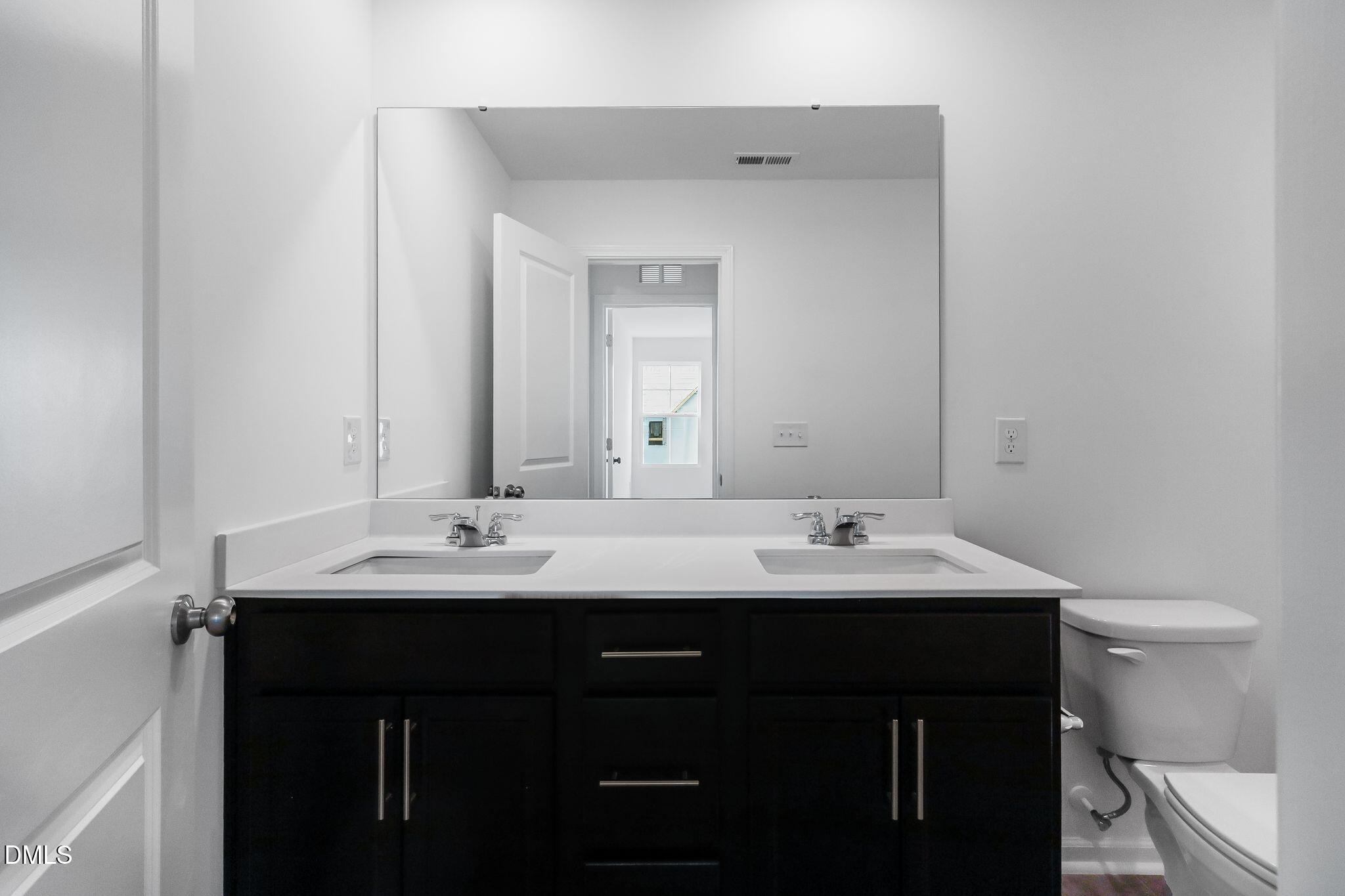 2939 Hickory Fld Drive Raleigh, NC 27616 - Photo 16 of 30 a bathroom with a sink and a toilet