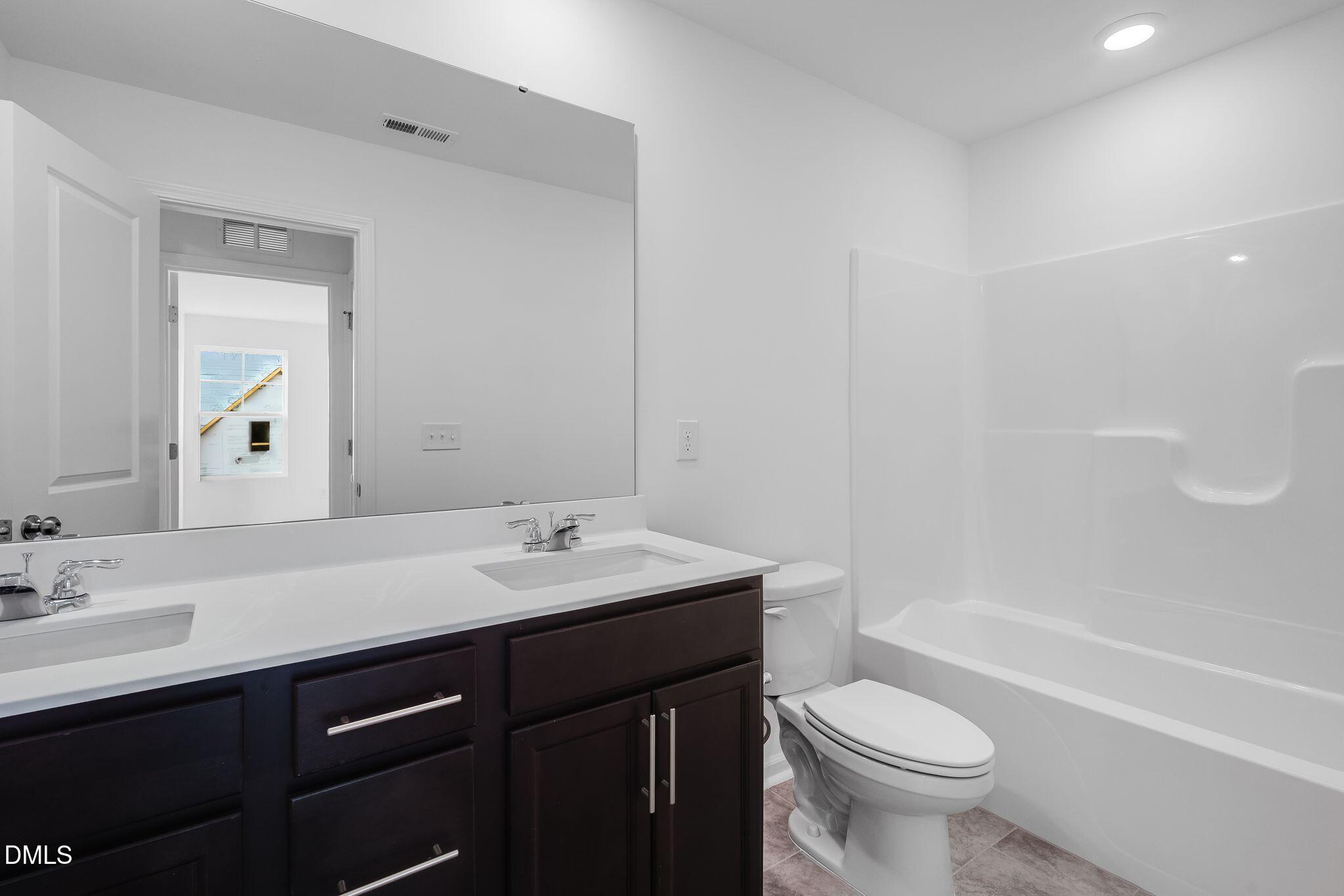 2939 Hickory Fld Drive Raleigh, NC 27616 - Photo 17 of 30 a bathroom with a sink a toilet and bathtub