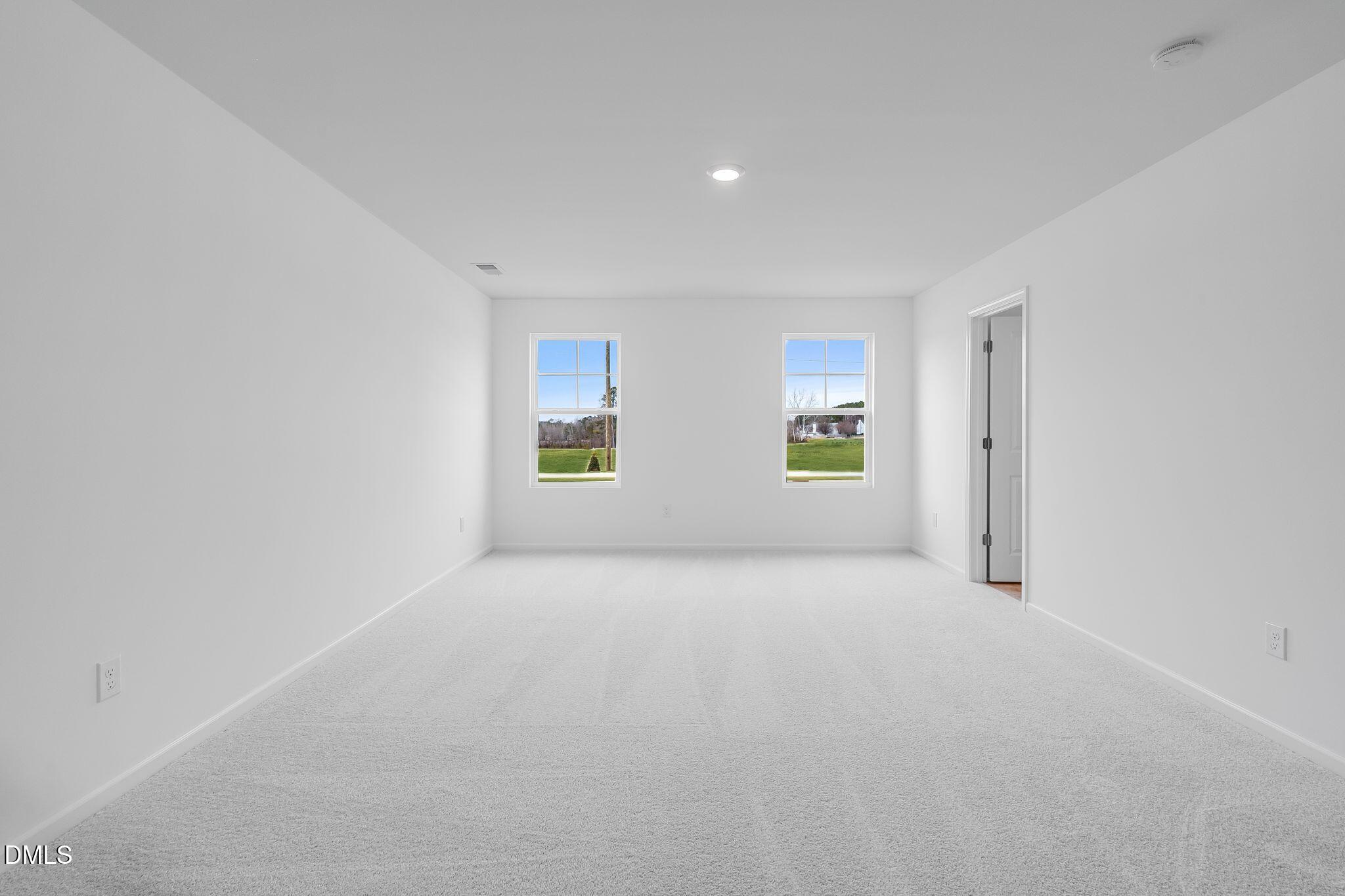 2939 Hickory Fld Drive Raleigh, NC 27616 - Photo 21 of 30 an empty room with windows